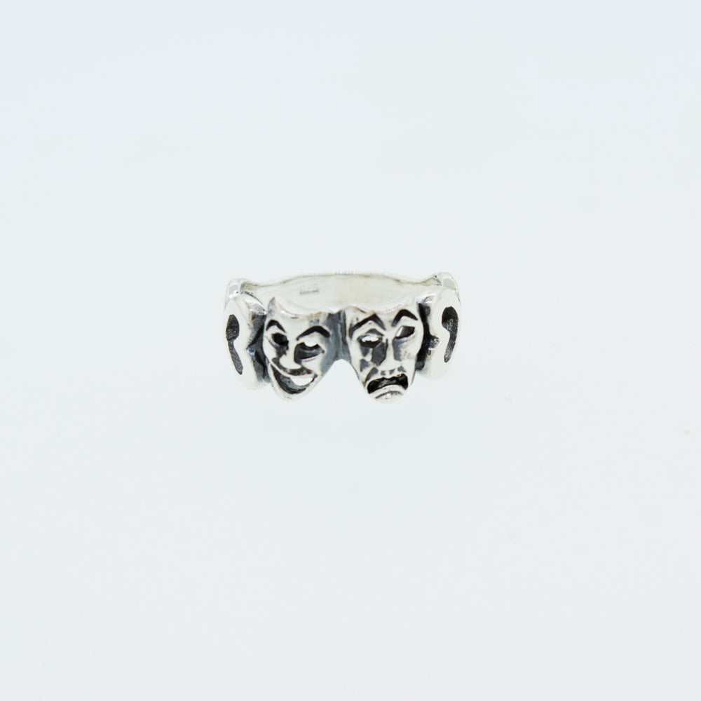 
                  
                    A Super Silver Comedy and Tragedy Ring, made of .925 silver, featuring three faces.
                  
                