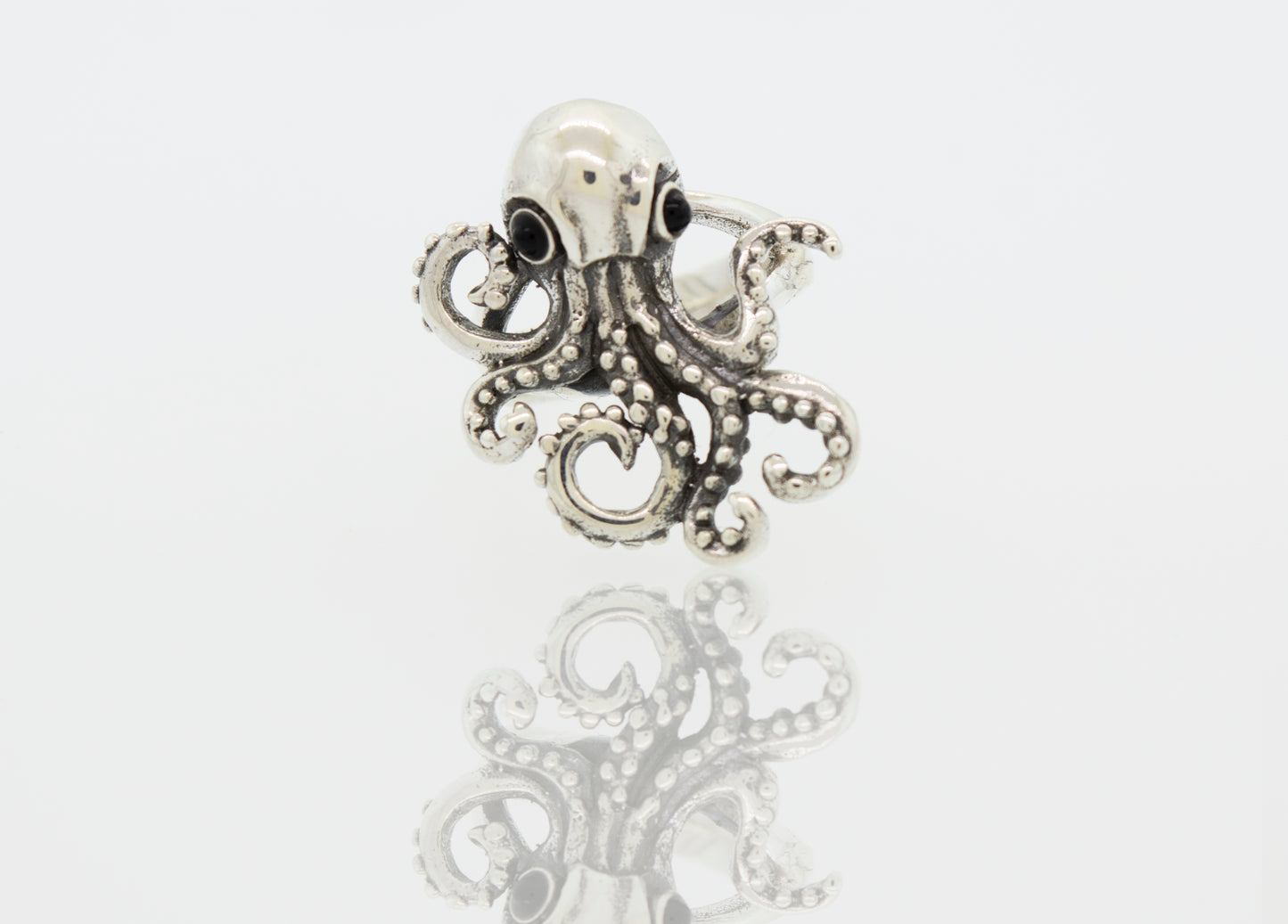 An Octopus Adjustable Ring with tentacle design on a white background.