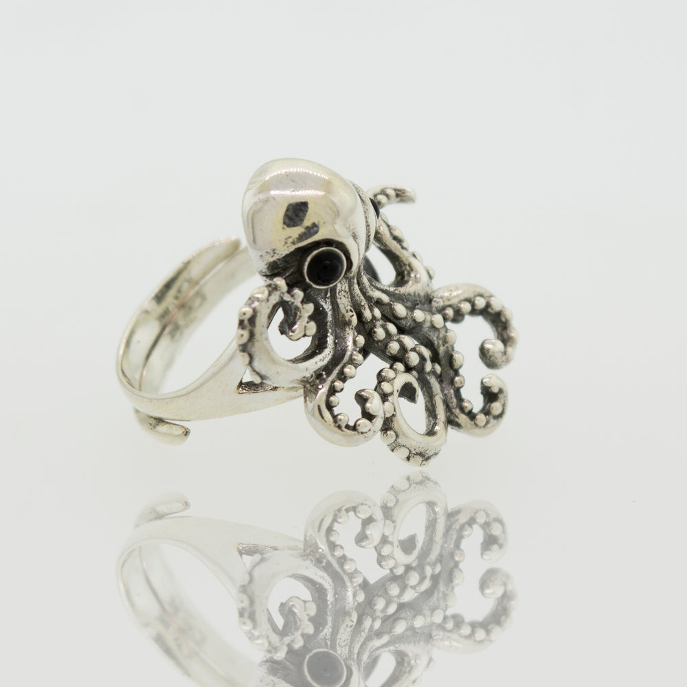 A designer Octopus Adjustable Ring with sterling silver tentacles on a white background.
