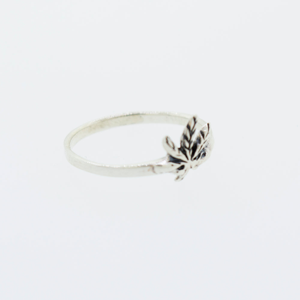 
                  
                    A simple Super Silver .925 sterling silver ring adorned with a delicate marijuana leaf.
                  
                
