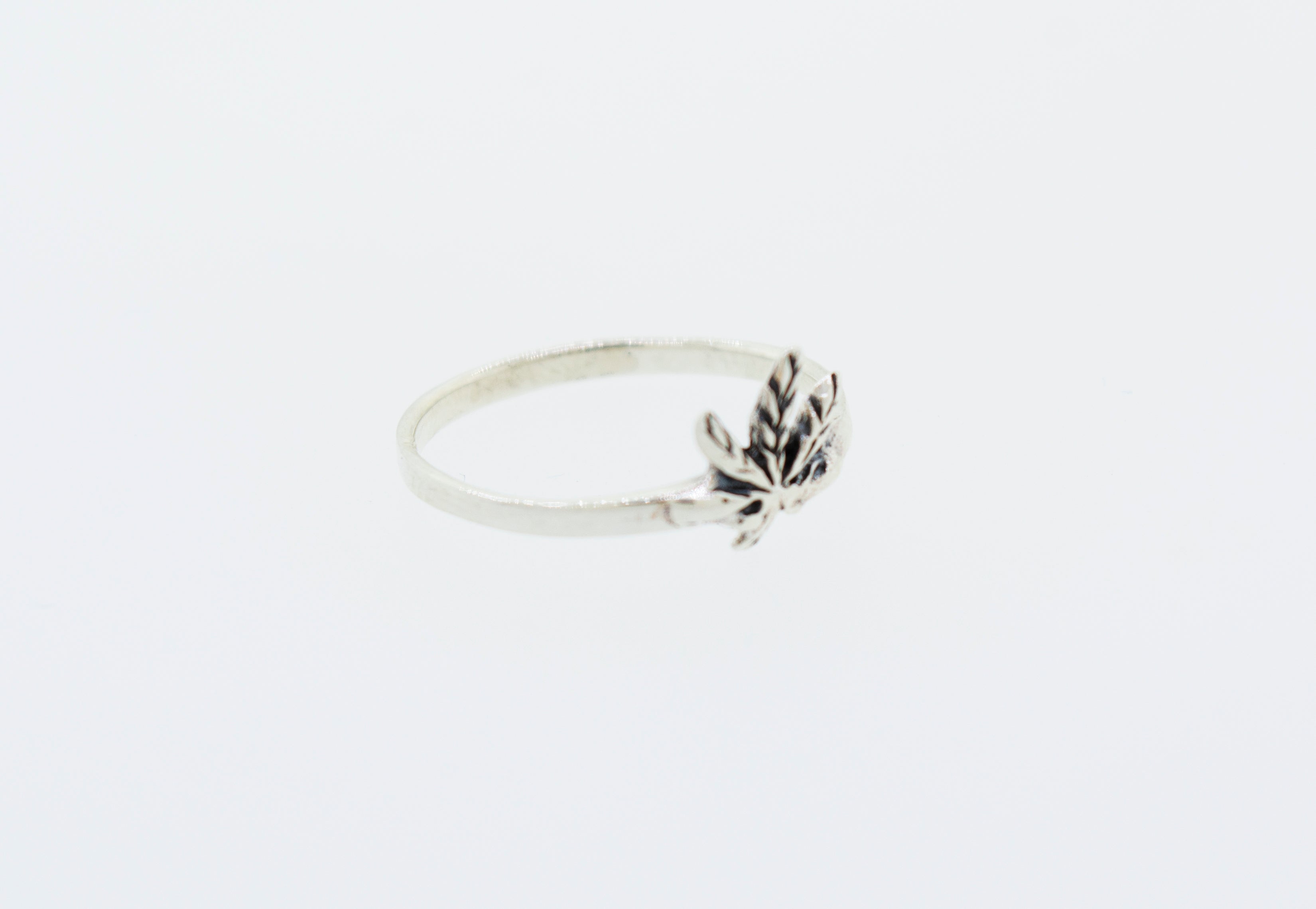 A simple Super Silver .925 sterling silver ring adorned with a delicate marijuana leaf.