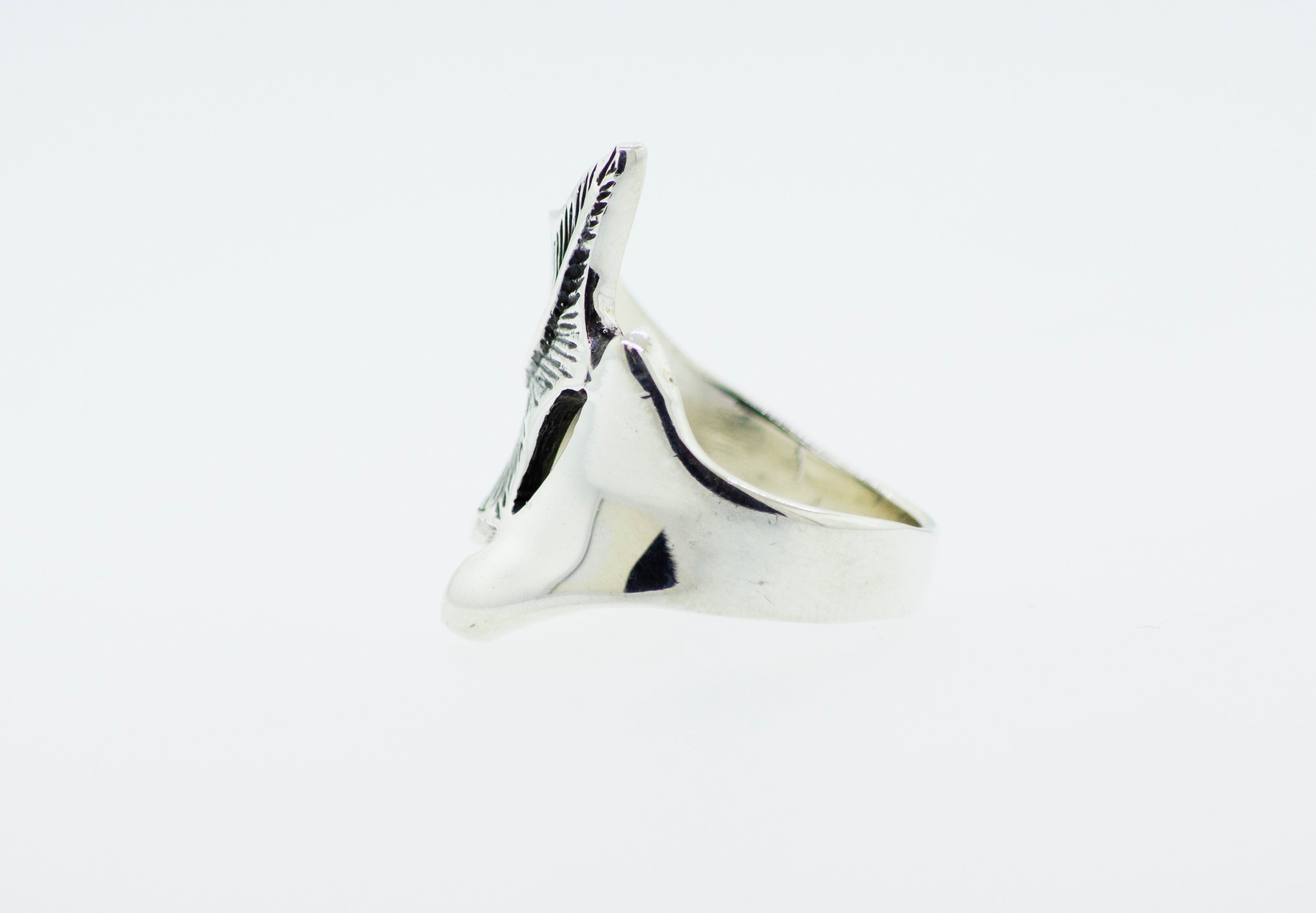 A Super Silver Etched Leaf Ring with a bird on it.