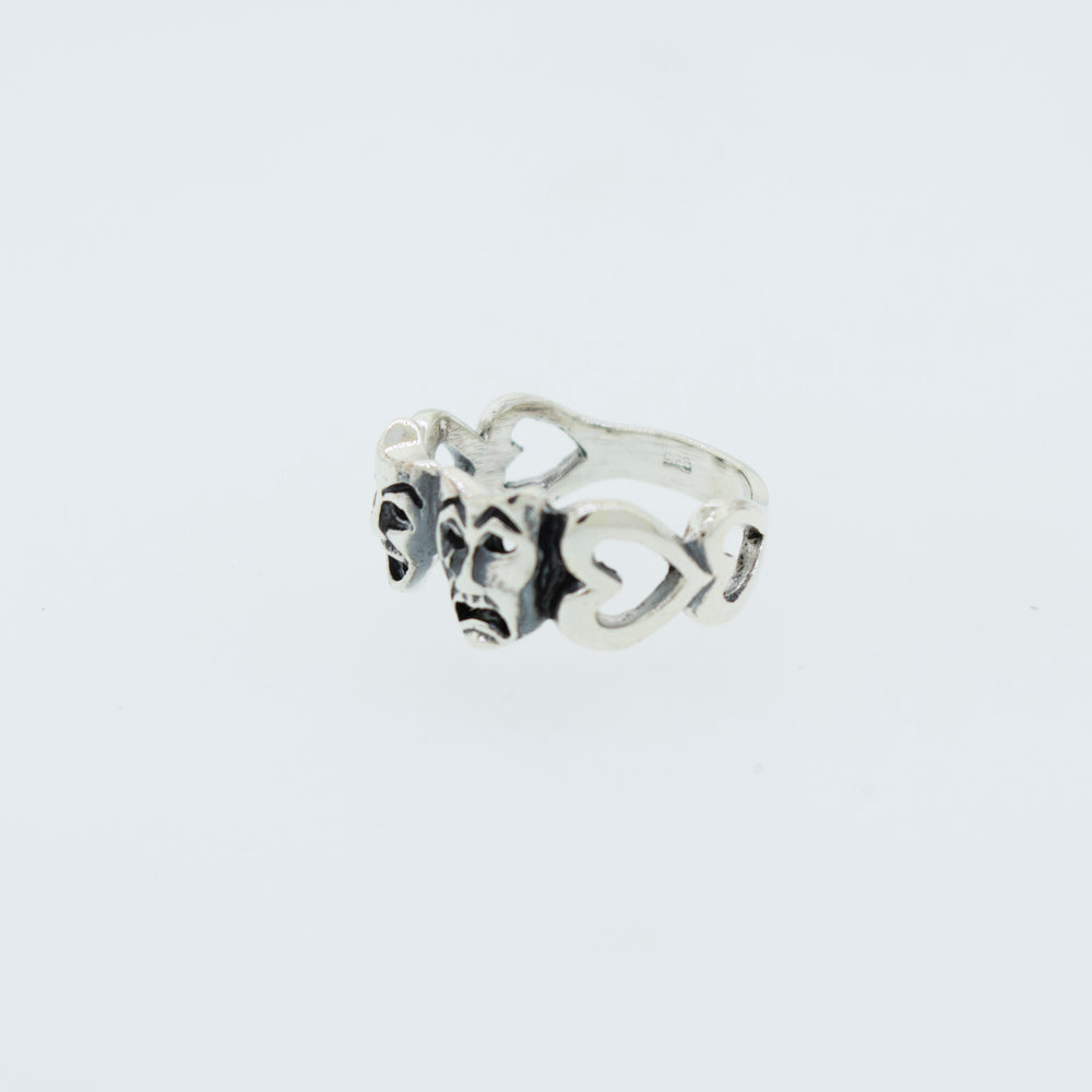 
                  
                    A classic Super Silver Comedy and Tragedy Ring with three hearts on it made of .925 silver.
                  
                