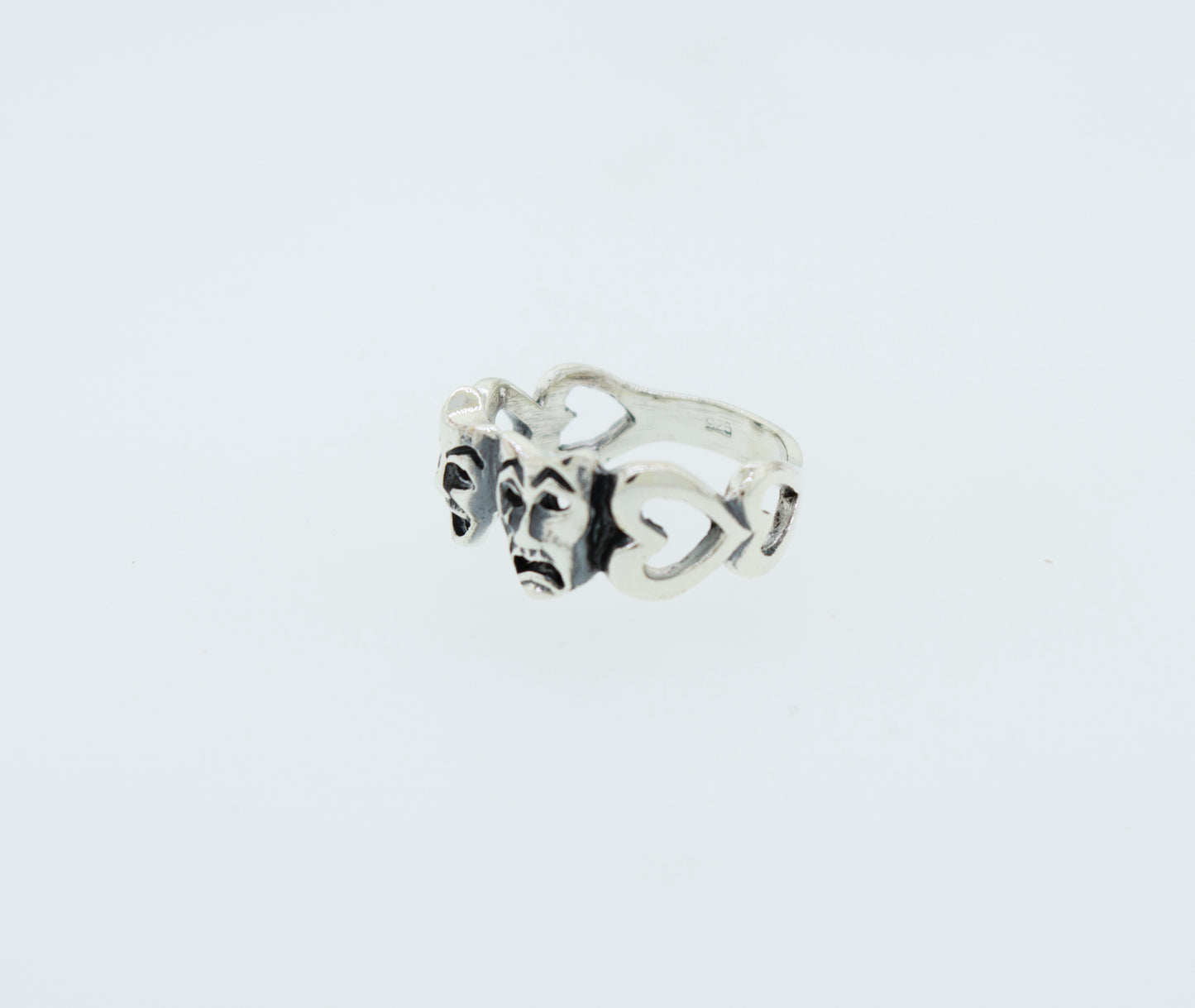 
                  
                    A classic Super Silver Comedy and Tragedy Ring with three hearts on it made of .925 silver.
                  
                
