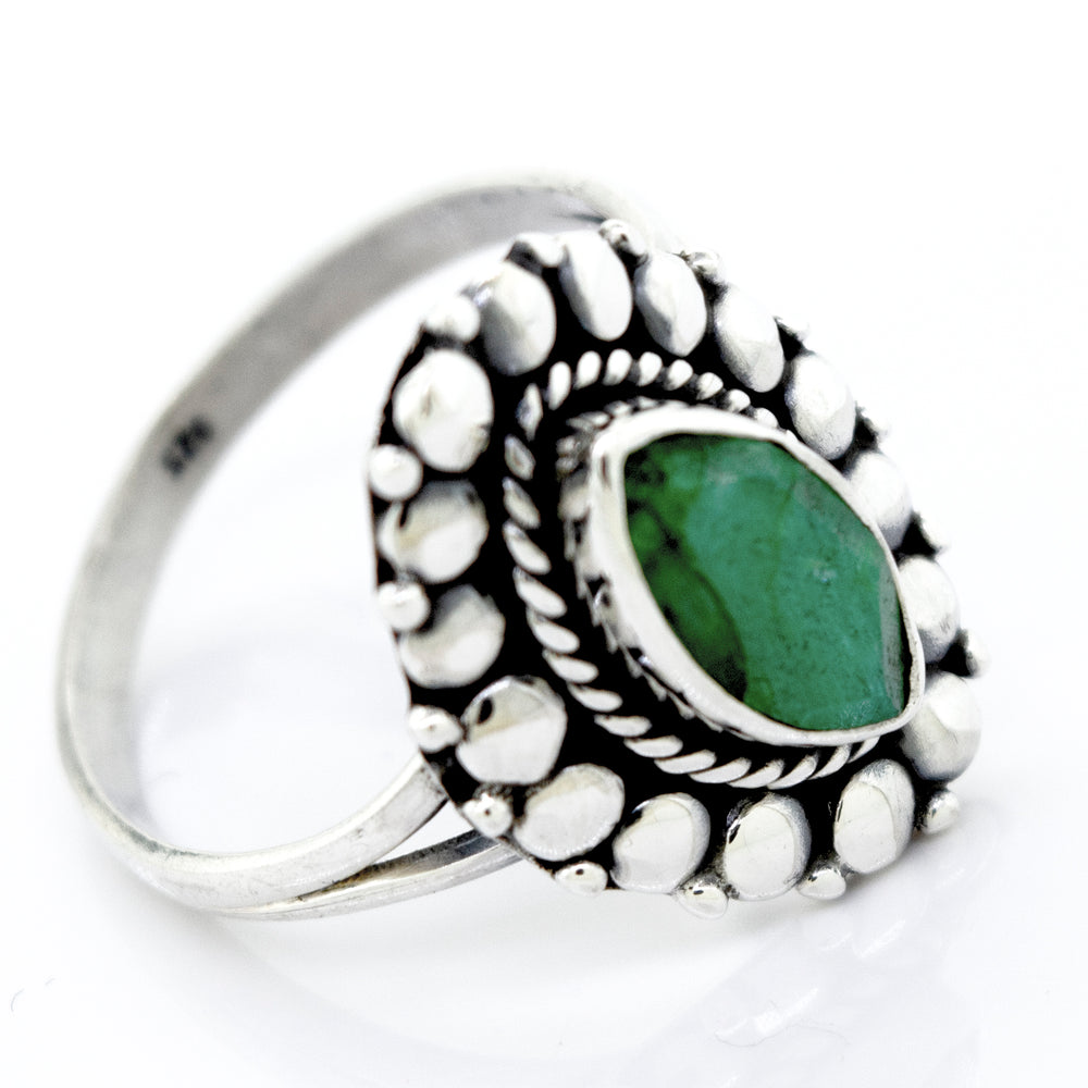 
                  
                    A Super Silver Marquise Shaped Vibrant Emerald Ring with a beaded design.
                  
                