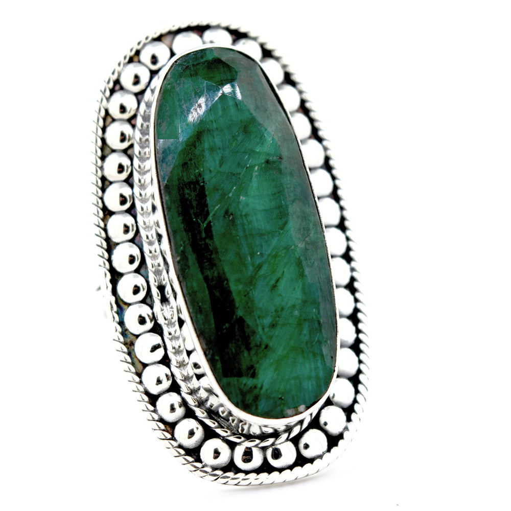 
                  
                    A Super Silver Elegant Raw Emerald Ring with an oval emerald stone.
                  
                
