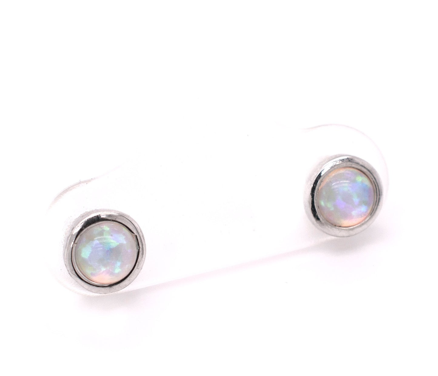 
                  
                    A pair of Radiant Australian Opal Studs from Super Silver showcasing brilliant colors on a white background.
                  
                