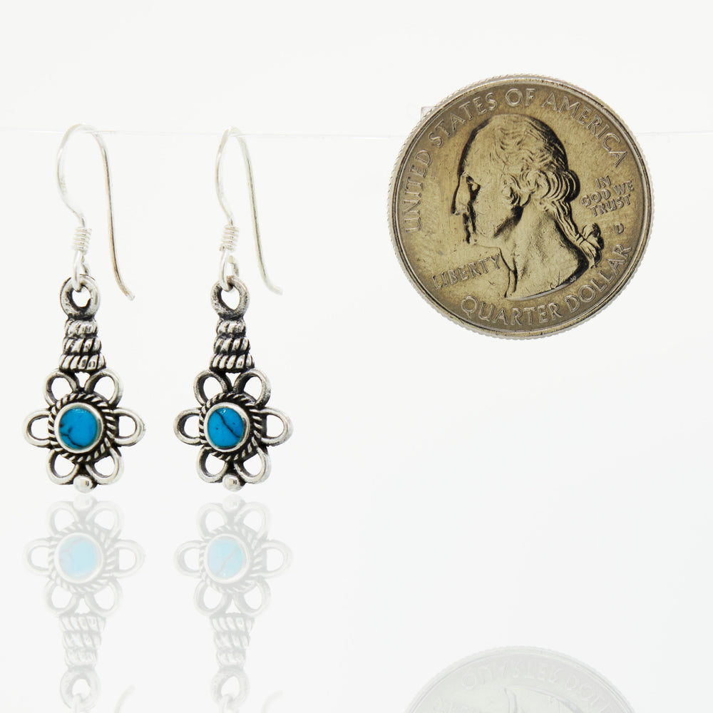 A pair of Super Silver Flower Design Earrings with a Round Stone.