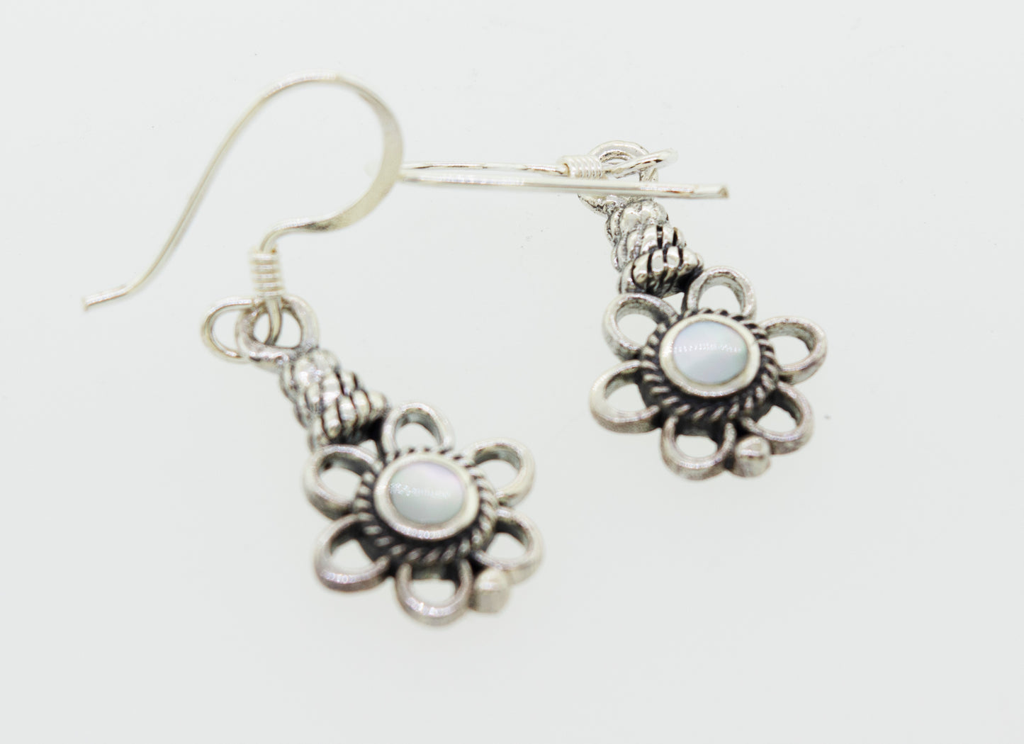 
                  
                    A pair of Flower Design Earrings With a Round Stone, crafted in sterling silver by Super Silver.
                  
                
