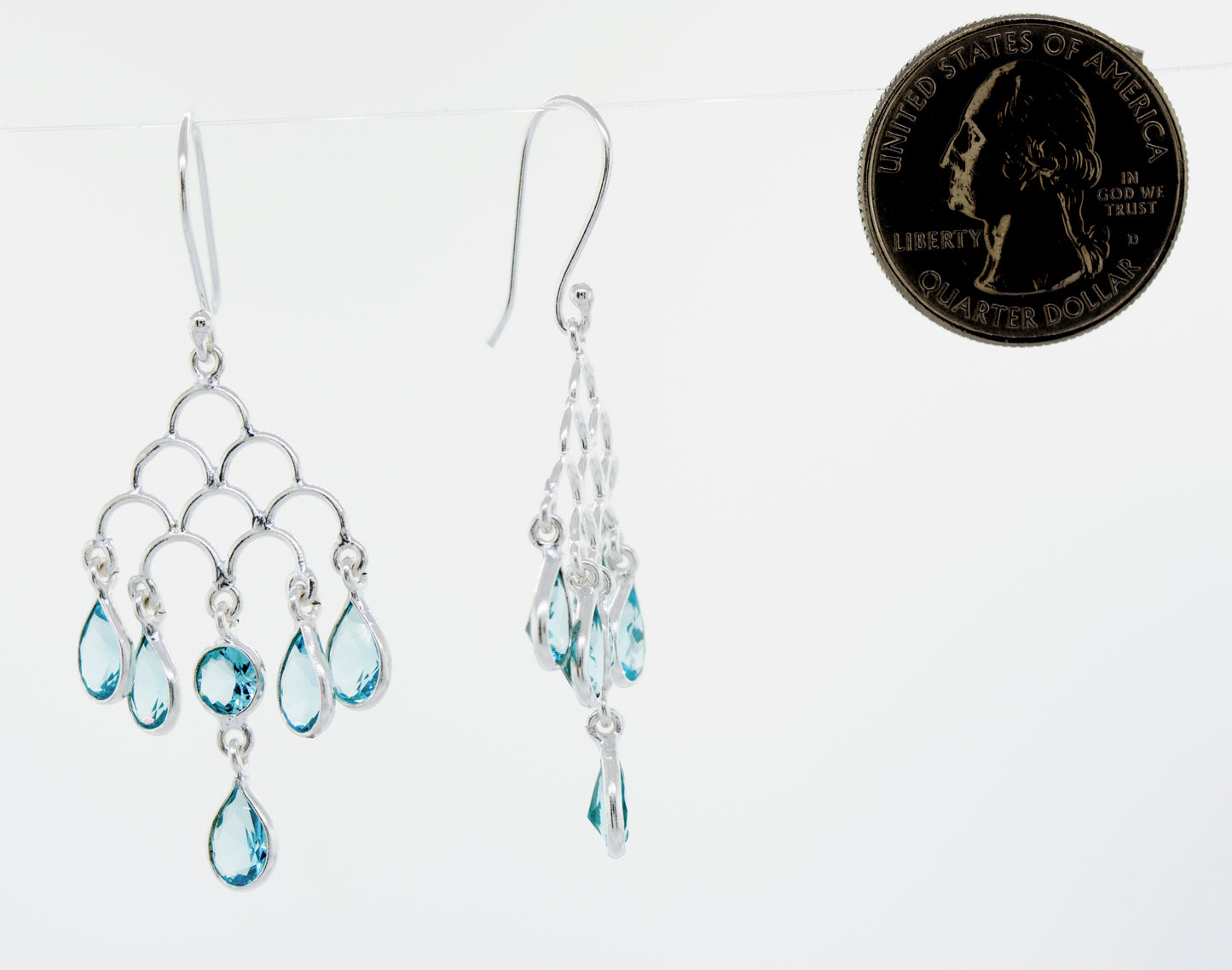 
                  
                    These stunning Faceted Ruby Chandelier Earrings feature a vibrant blue topaz gemstone set in elegant Super Silver.
                  
                