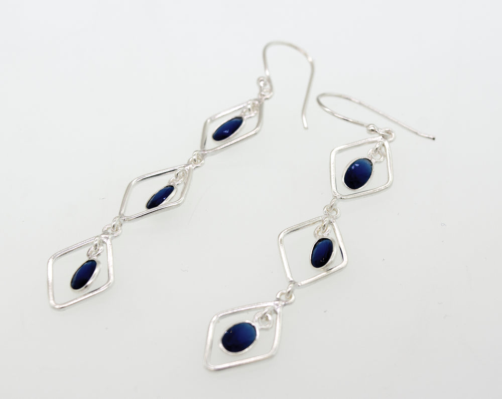 A pair of Super Silver Wire Diamond Earrings with Sapphire, measuring 2.5 inches long.