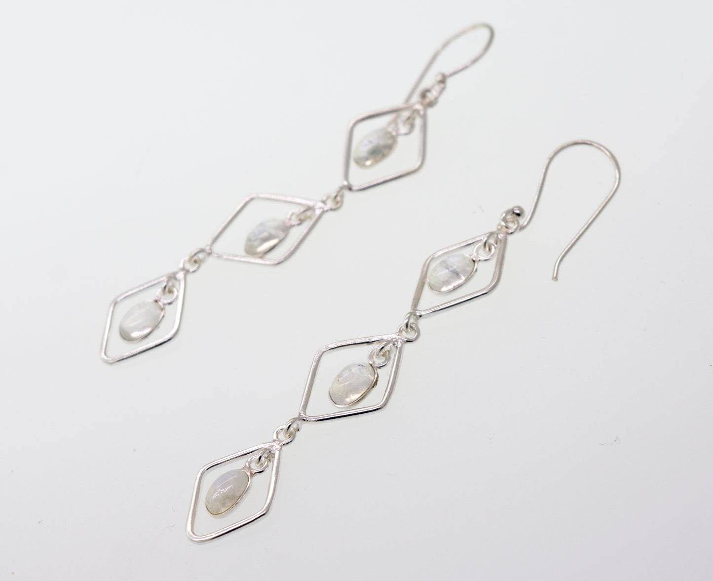 A pair of Super Silver Wire Diamond Earrings with Moonstone, 2.5 inches long.