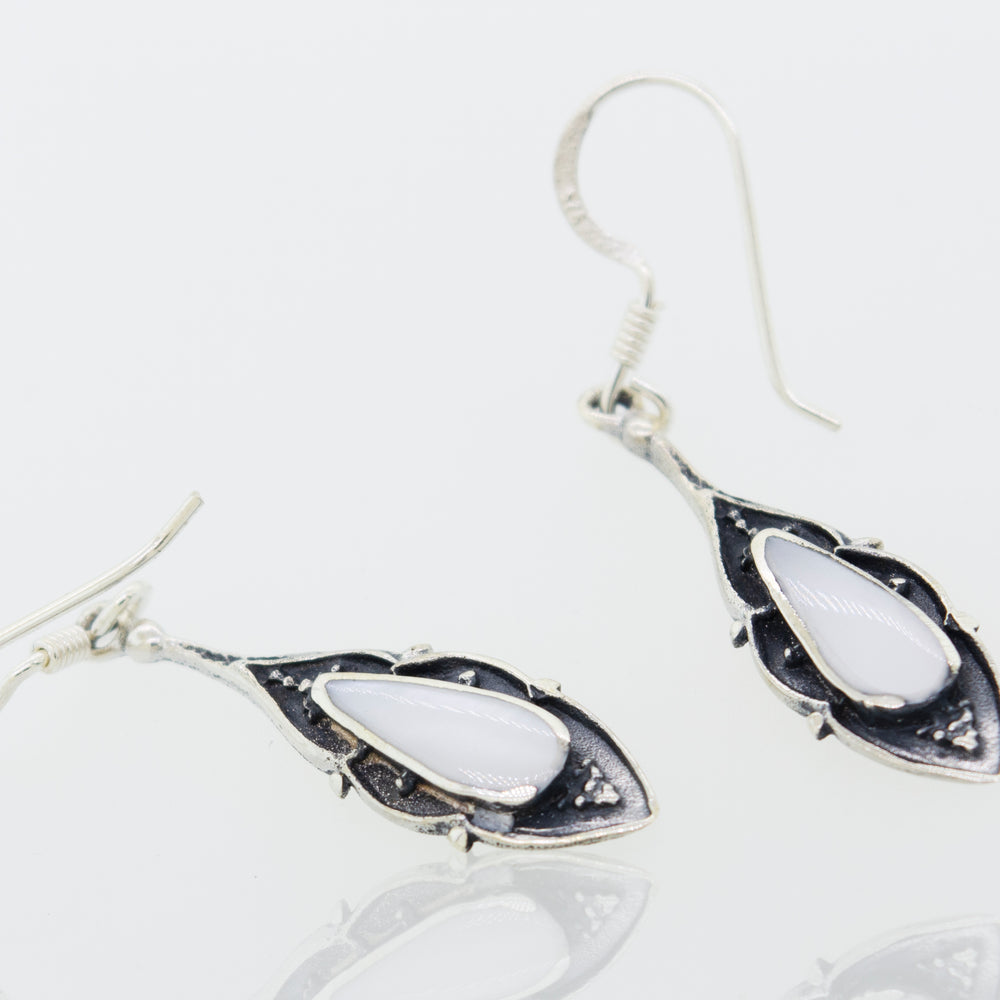 A pair of Super Silver Teardrop Shape White Mother Of Pearl Earrings.