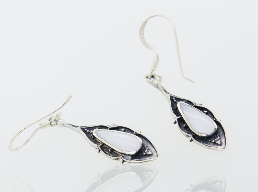 A pair of Super Silver Teardrop Shape White Mother Of Pearl Earrings.