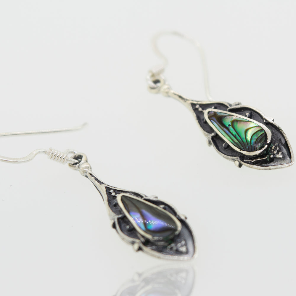 A pair of Teardrop Shape Abalone Earrings from Super Silver featuring an oxidized finish.