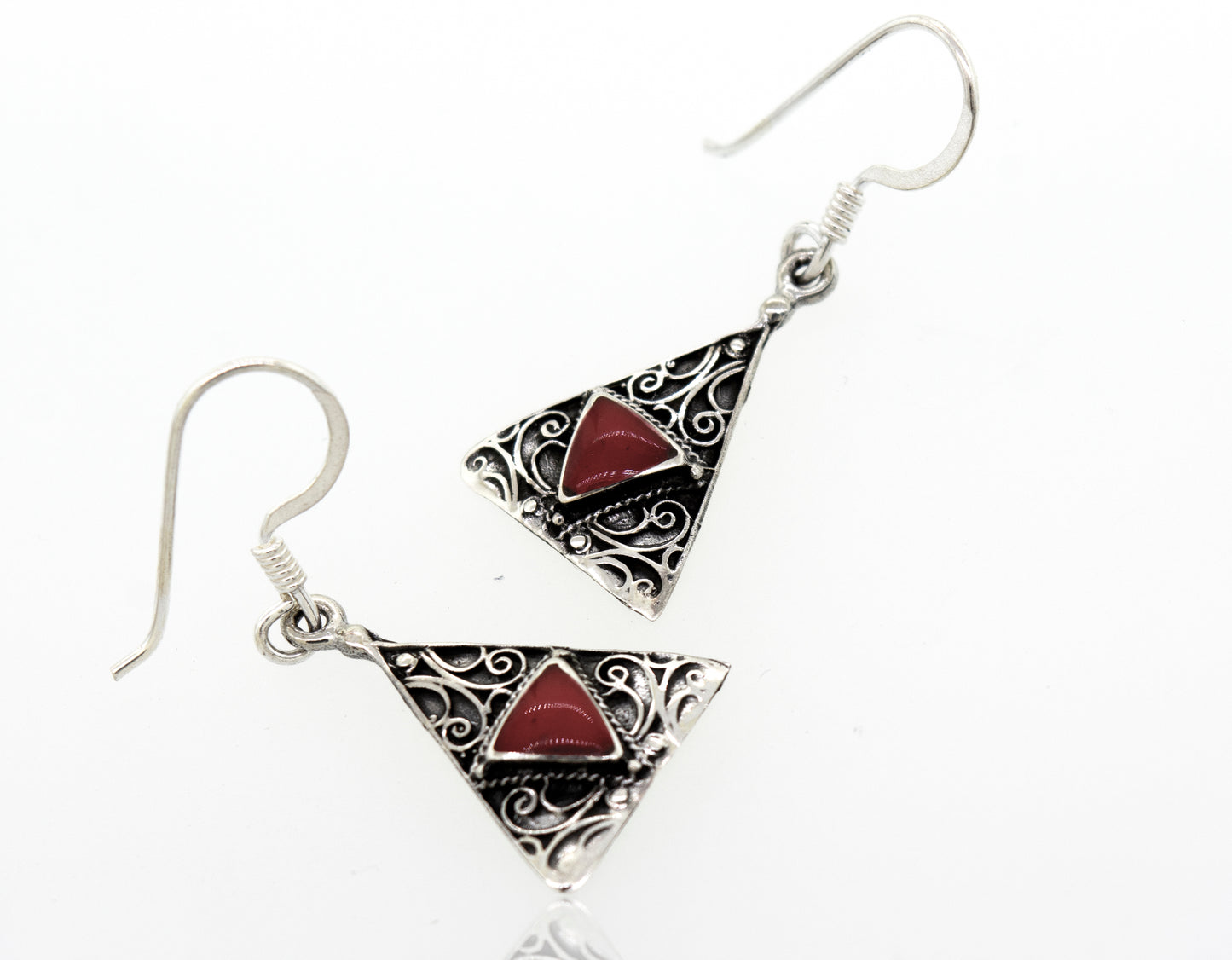 These Freestyle Design Triangle Shape Coral Earrings from Super Silver feature a stunning red coral stone in the middle.
