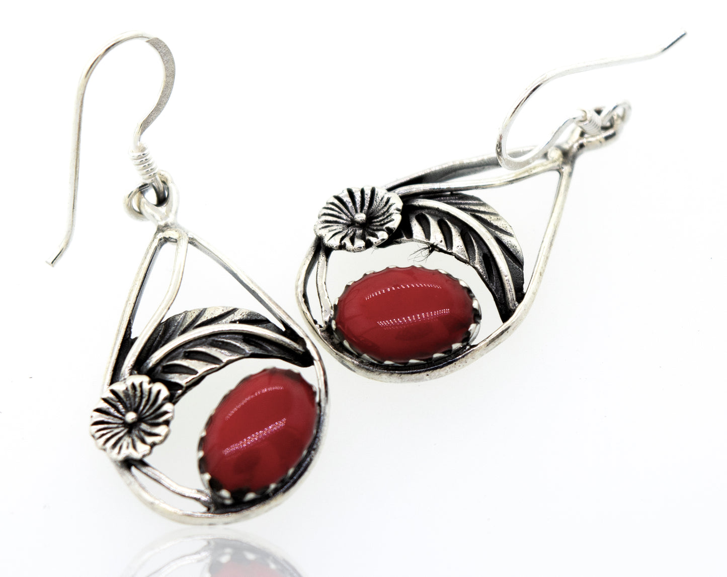 
                  
                    These Red Coral Teardrop Earrings With Floral Setting are crafted from high-quality sterling silver and feature vibrant red coral accents. They are from the Super Silver brand.
                  
                