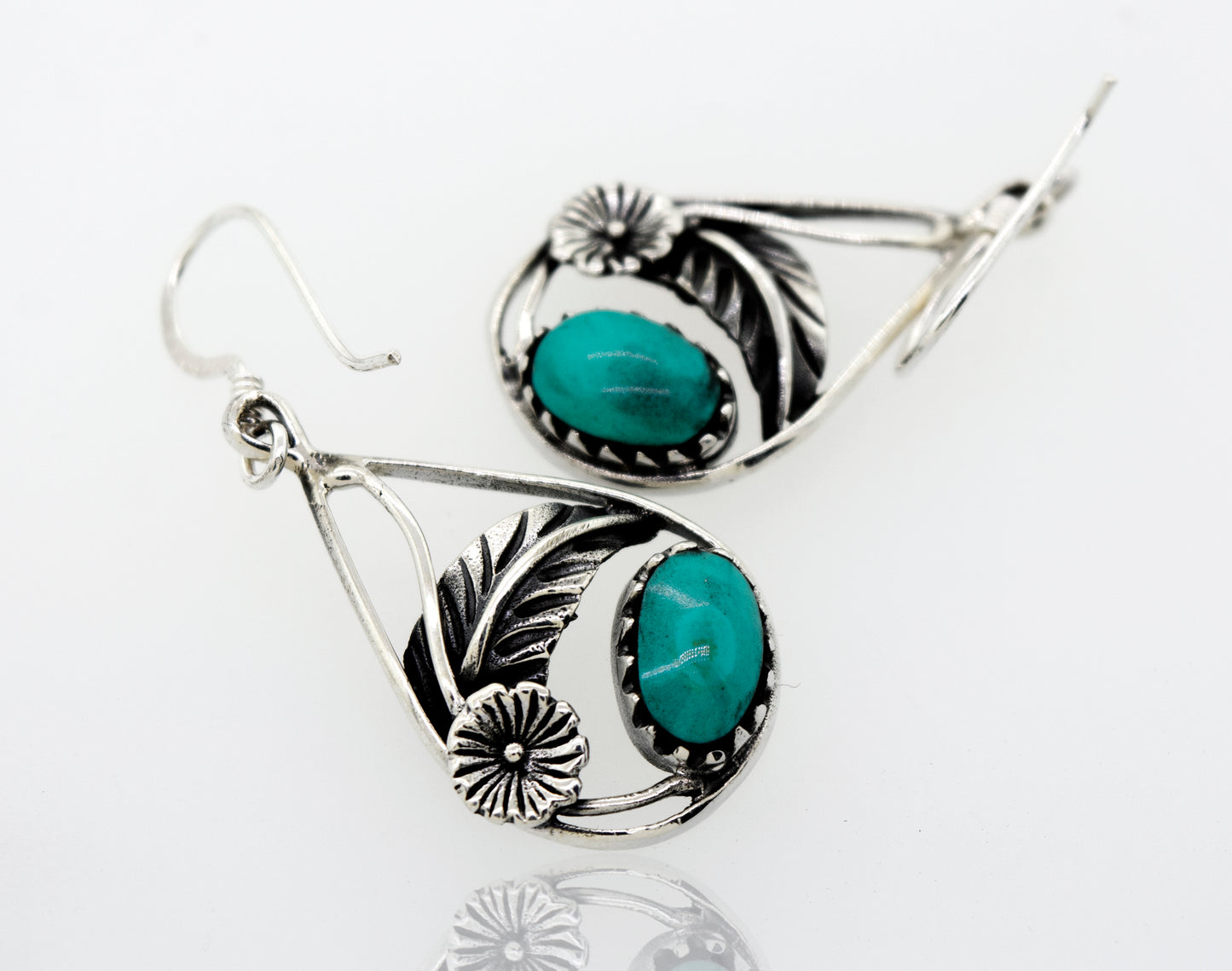A pair of Turquoise Teardrop Earrings With Floral Setting from Super Silver, crafted from 925 sterling silver.