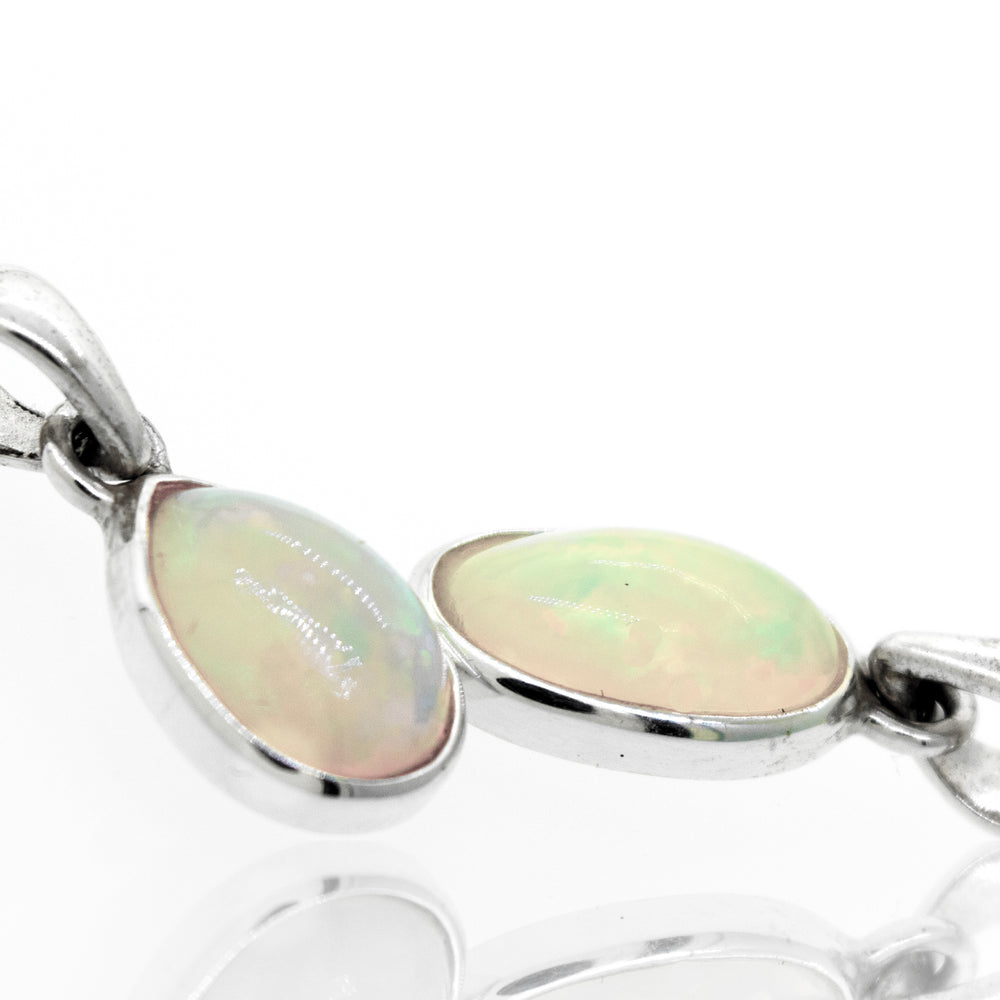 Two Magical Ethiopian Opal pendants from Super Silver on a white surface.