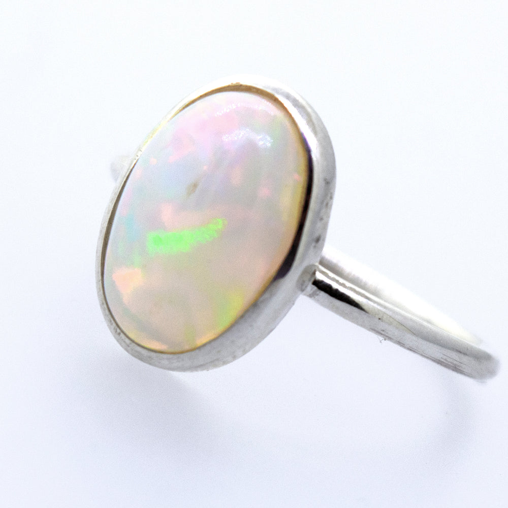 
                  
                    An Ethiopian Opal Ring with Oval Stone on a white surface.
                  
                