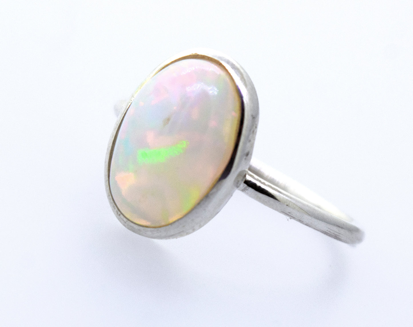 
                  
                    An Ethiopian Opal Ring with Oval Stone on a white surface.
                  
                