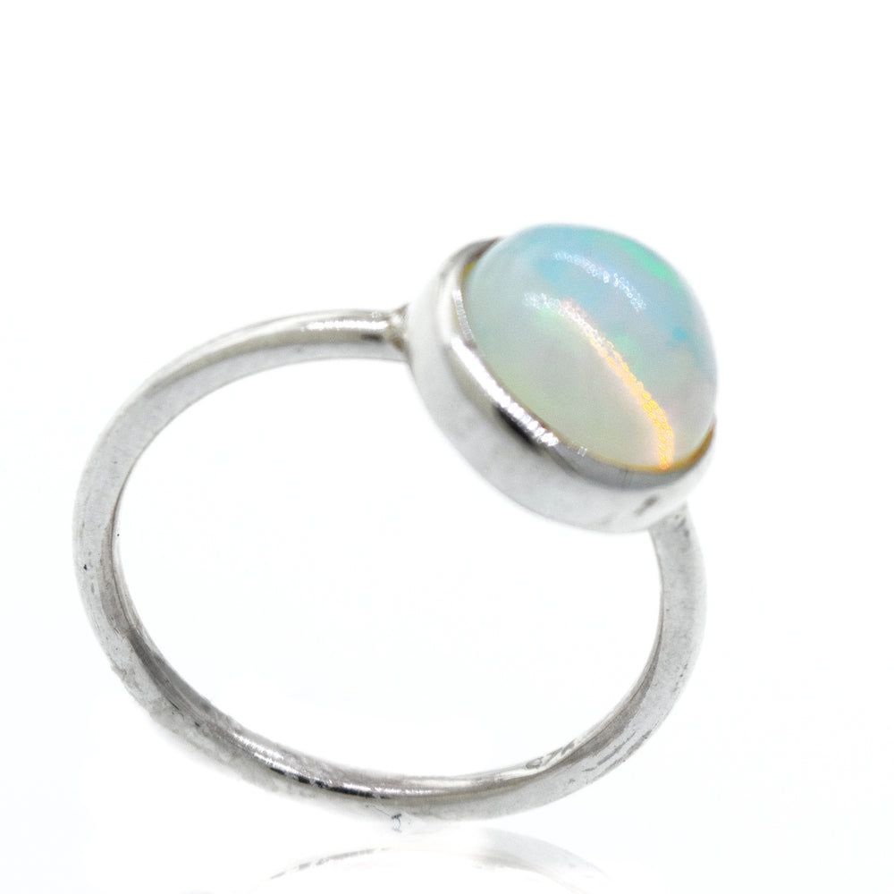 An elegant Round Ethiopian Opal Ring on a white background.