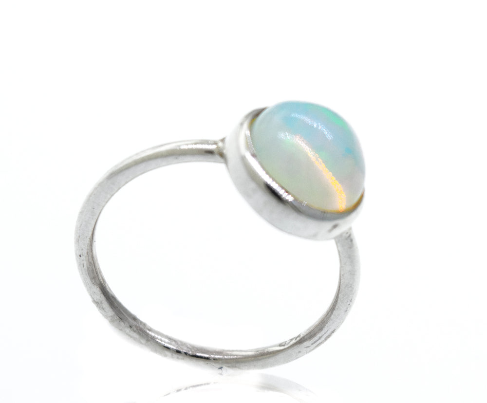 
                  
                    An elegant Round Ethiopian Opal Ring on a white background.
                  
                