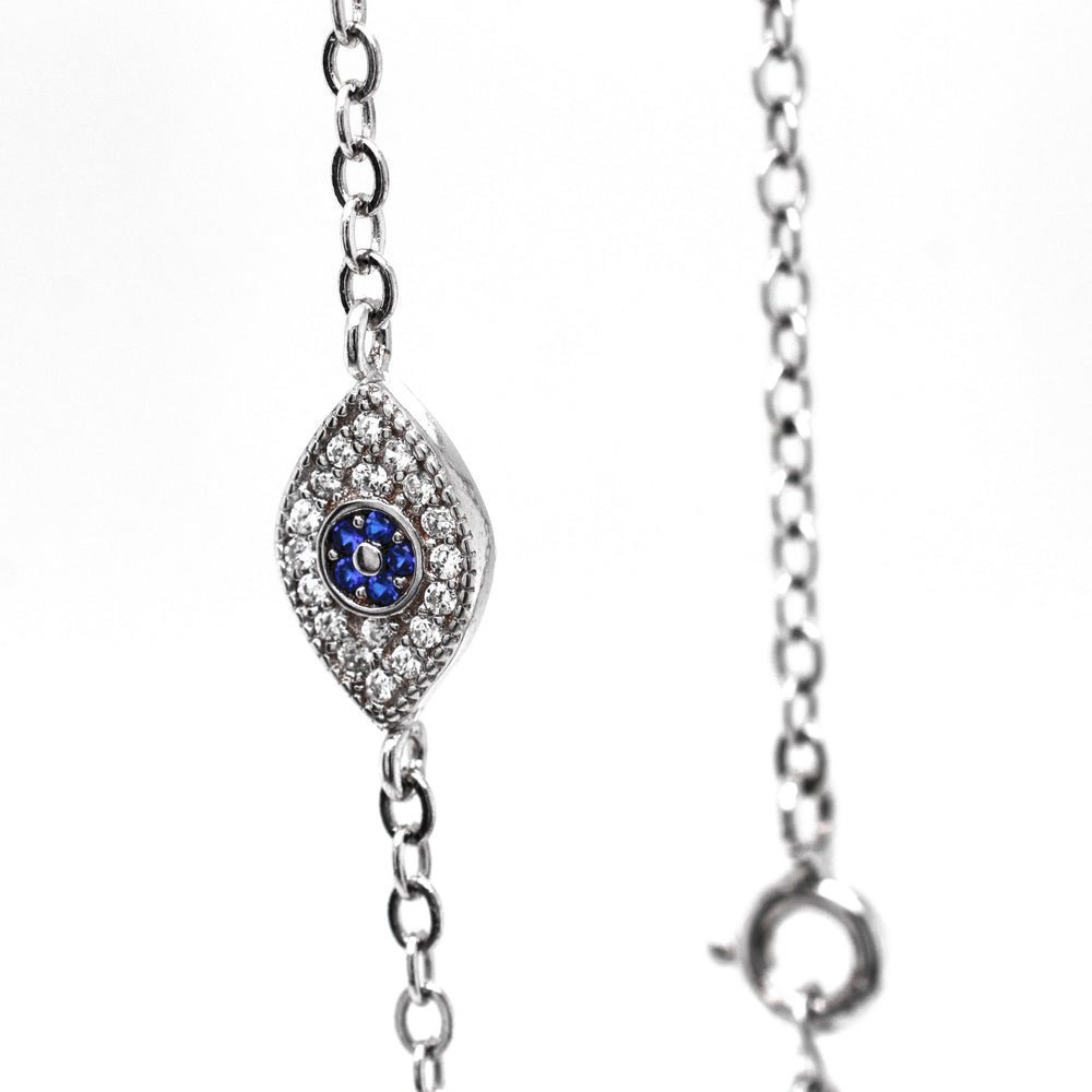 
                  
                    A stunning Classic Blue Pave Cubic Zirconia Evil Eye Bracelet adorned with exquisite diamonds and sapphires from Super Silver.
                  
                