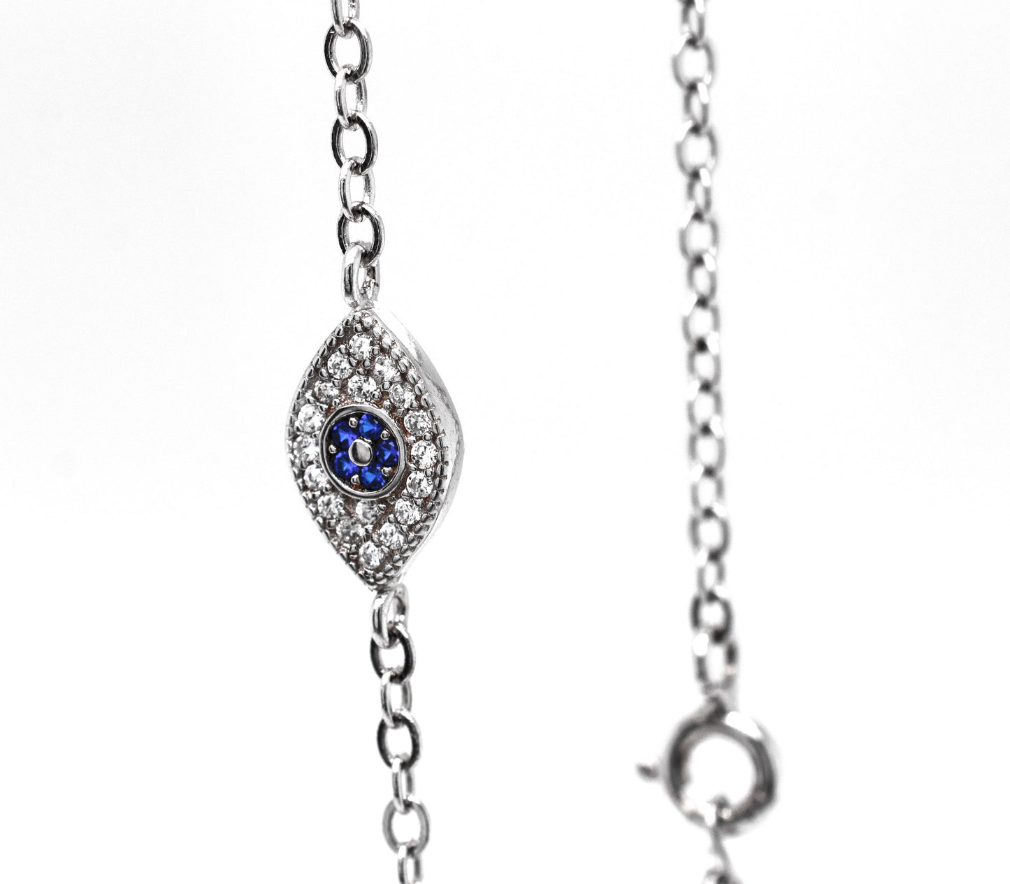 
                  
                    A stunning Classic Blue Pave Cubic Zirconia Evil Eye Bracelet adorned with exquisite diamonds and sapphires from Super Silver.
                  
                