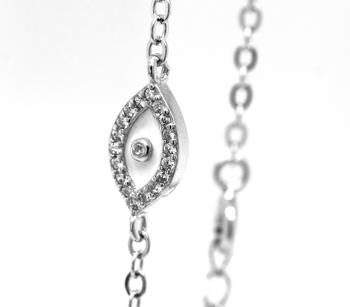
                  
                    A silver chain with a protective Trendy Pave Cubic Zirconia Evil Eye Bracelet, encrusted with cubic zirconia stones, from Super Silver.
                  
                