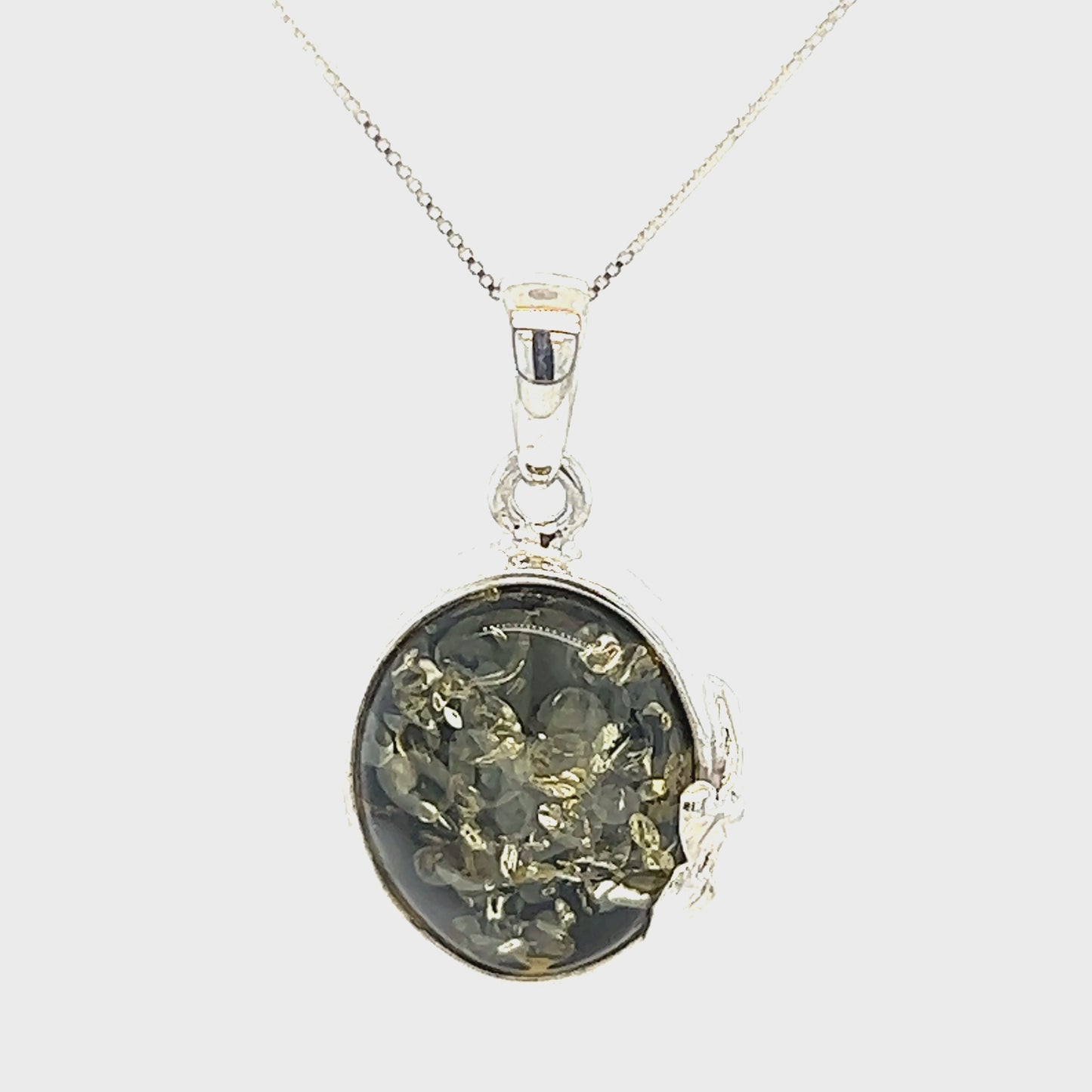 
                  
                    Load and play video in Gallery viewer, Green Amber Oval Pendant with Delicate Leaf
                  
                