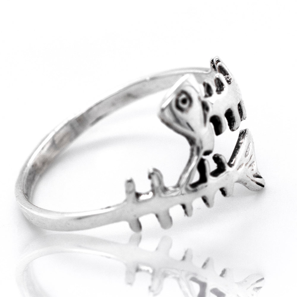 
                  
                    A sterling silver Fish Skeleton Ring inspired by the ocean.
                  
                