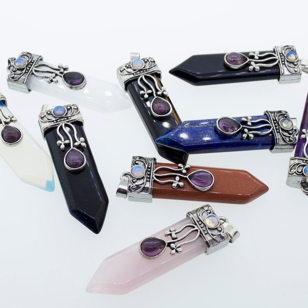 
                  
                    A collection of Obelisk Crystal Stone Pendants by Super Silver with a boho flair.
                  
                