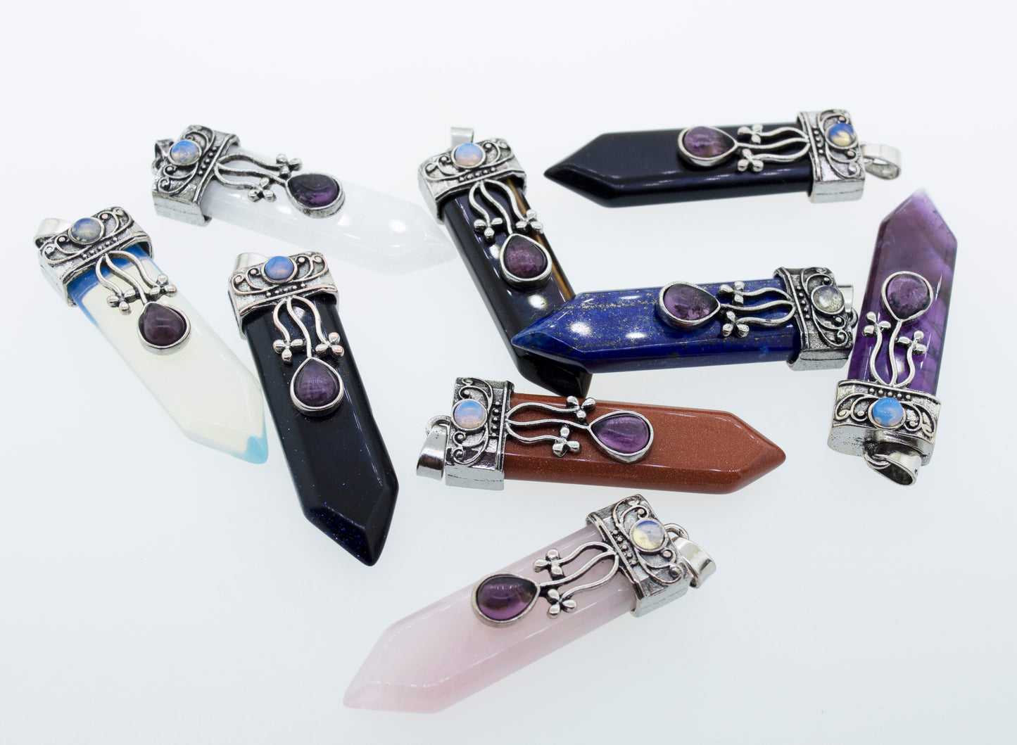 
                  
                    A collection of Obelisk Crystal Stone Pendants by Super Silver with a boho flair.
                  
                