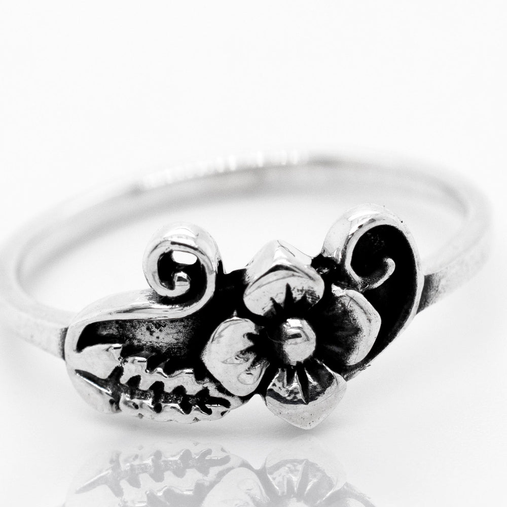 
                  
                    A boho-inspired Flower With Leaf And Swirl Design Ring, reminiscent of the vibrant Santa Cruz style.
                  
                