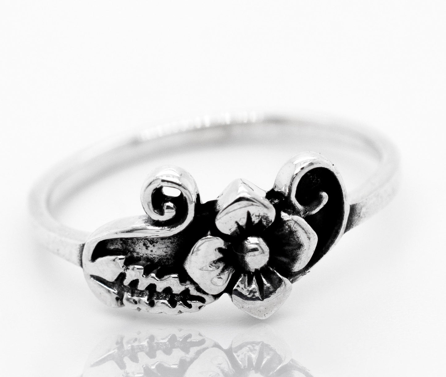 
                  
                    A boho-inspired Flower With Leaf And Swirl Design Ring, reminiscent of the vibrant Santa Cruz style.
                  
                