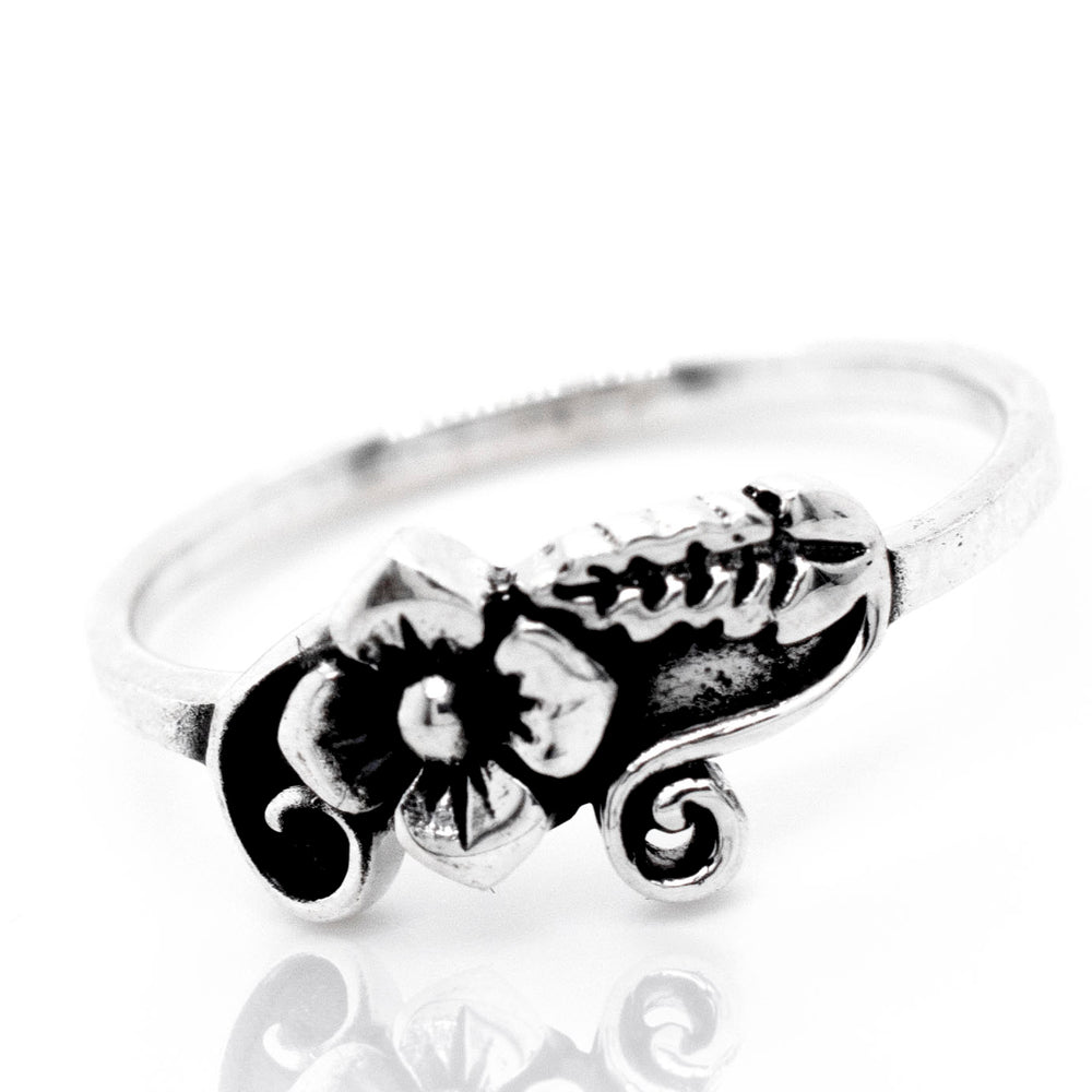 A Flower With Leaf And Swirl Design ring.