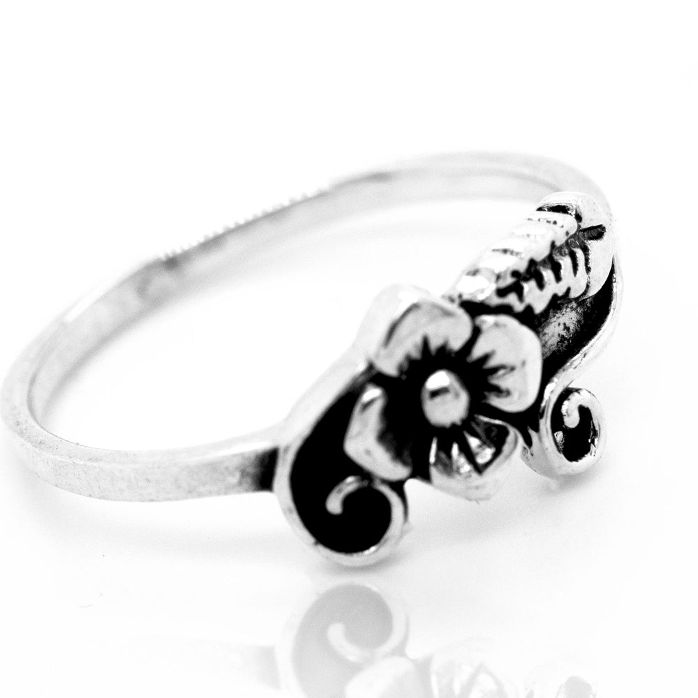 A Flower with Leaf and Swirl Design Ring that embodies the essence of nature.