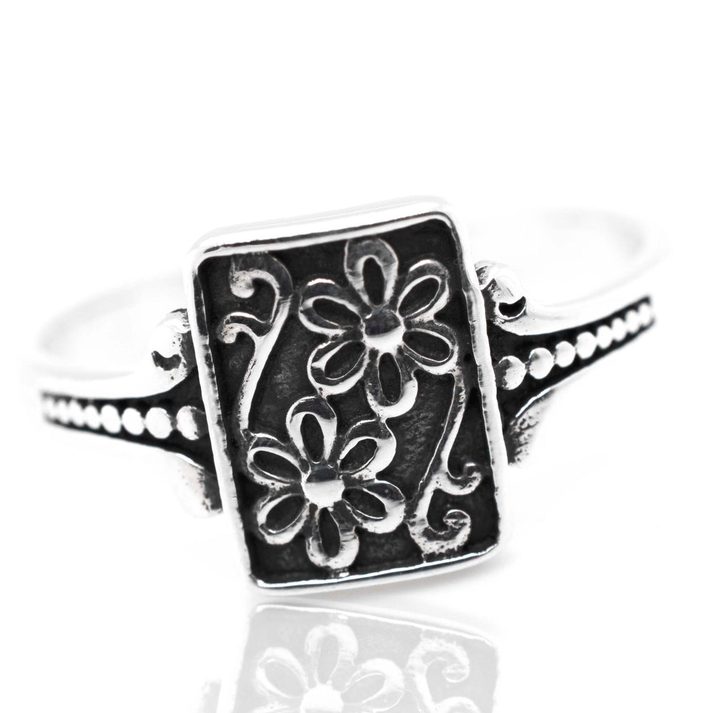 
                  
                    A Shield With Flower Pattern ring.
                  
                