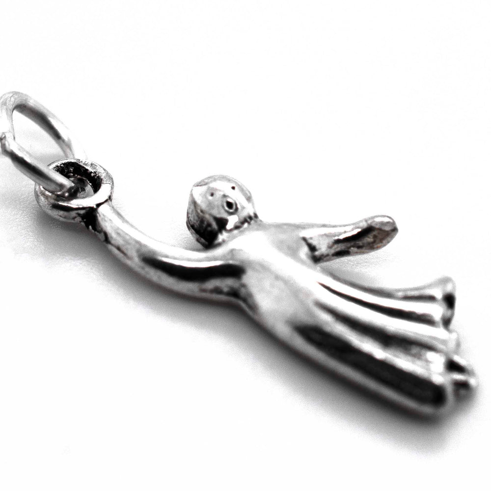A Super Silver Ghost Charm with a flying angel on it, perfect for adding to your silver collection.