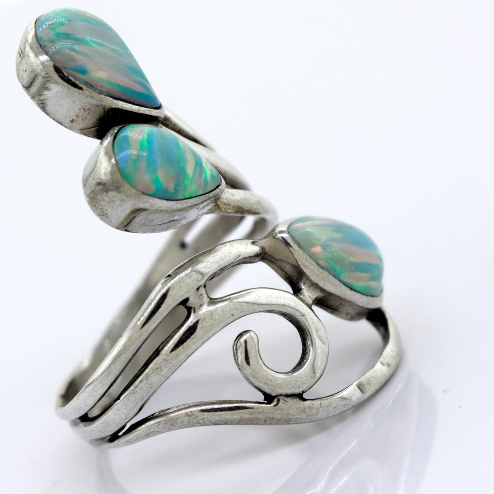 
                  
                    A handcrafted Super Silver wrap-around opal ring featuring a stunning blue opal stone.
                  
                
