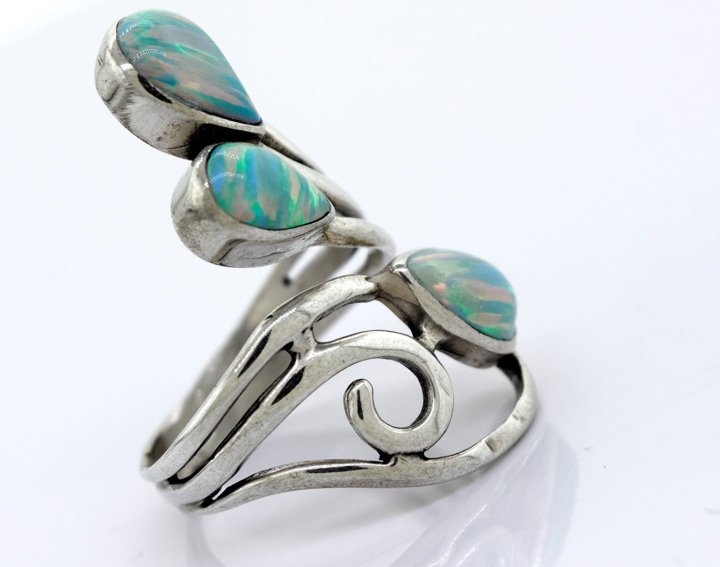 
                  
                    A handcrafted Super Silver wrap-around opal ring featuring a stunning blue opal stone.
                  
                