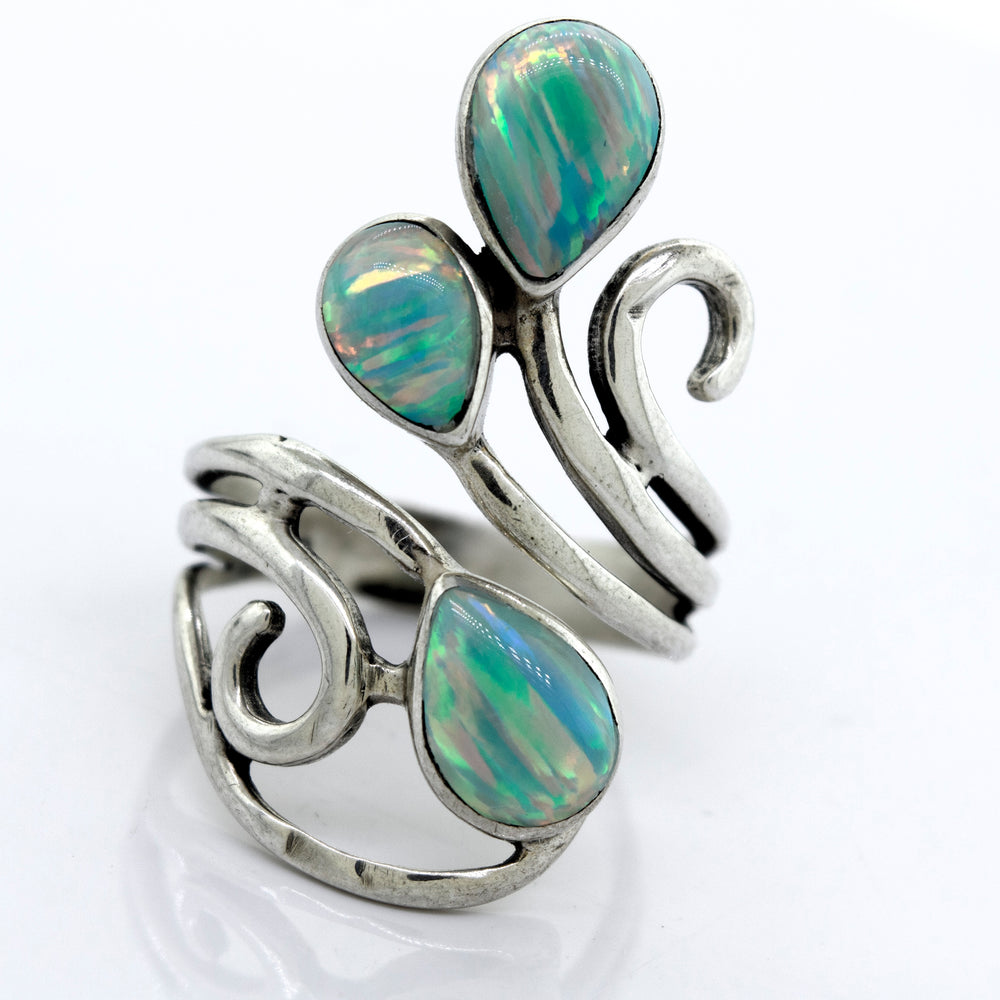 
                  
                    A Stunning Wrap-Around Opal Ring with opal stones and swirls, handcrafted by Super Silver.
                  
                