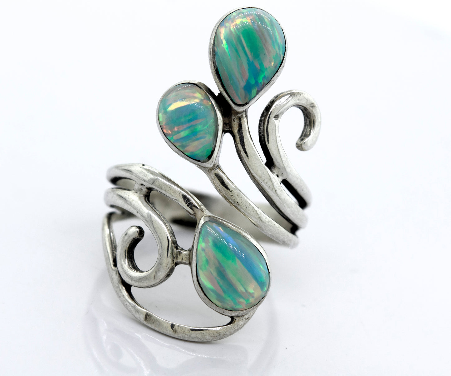 
                  
                    A Stunning Wrap-Around Opal Ring with opal stones and swirls, handcrafted by Super Silver.
                  
                
