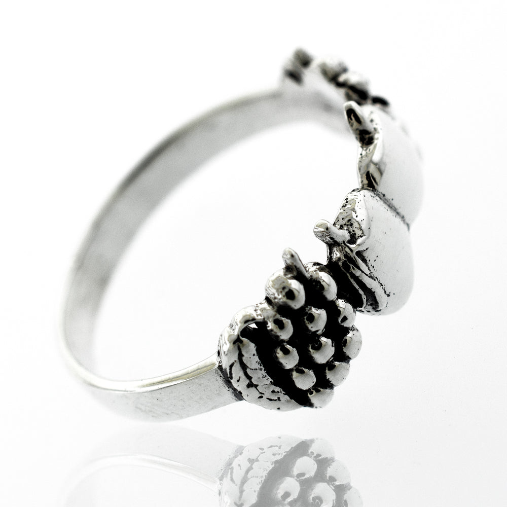 An Apples And Grapes Design ring adorned with acorns.