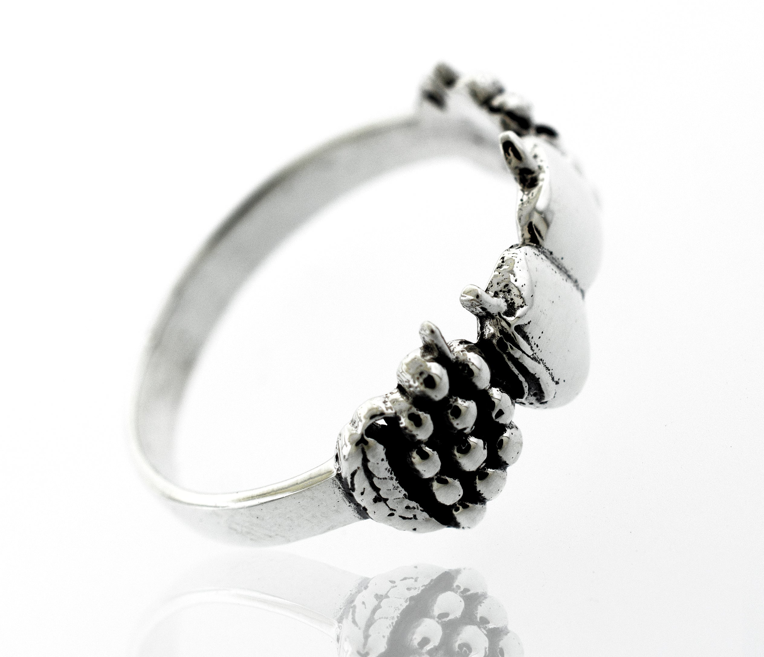 An Apples And Grapes Design ring adorned with acorns.