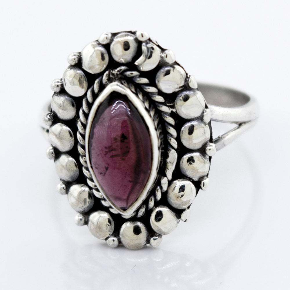A Marquise Shaped Vibrant Garnet Ring with a garnet stone in a silver setting by Super Silver.
