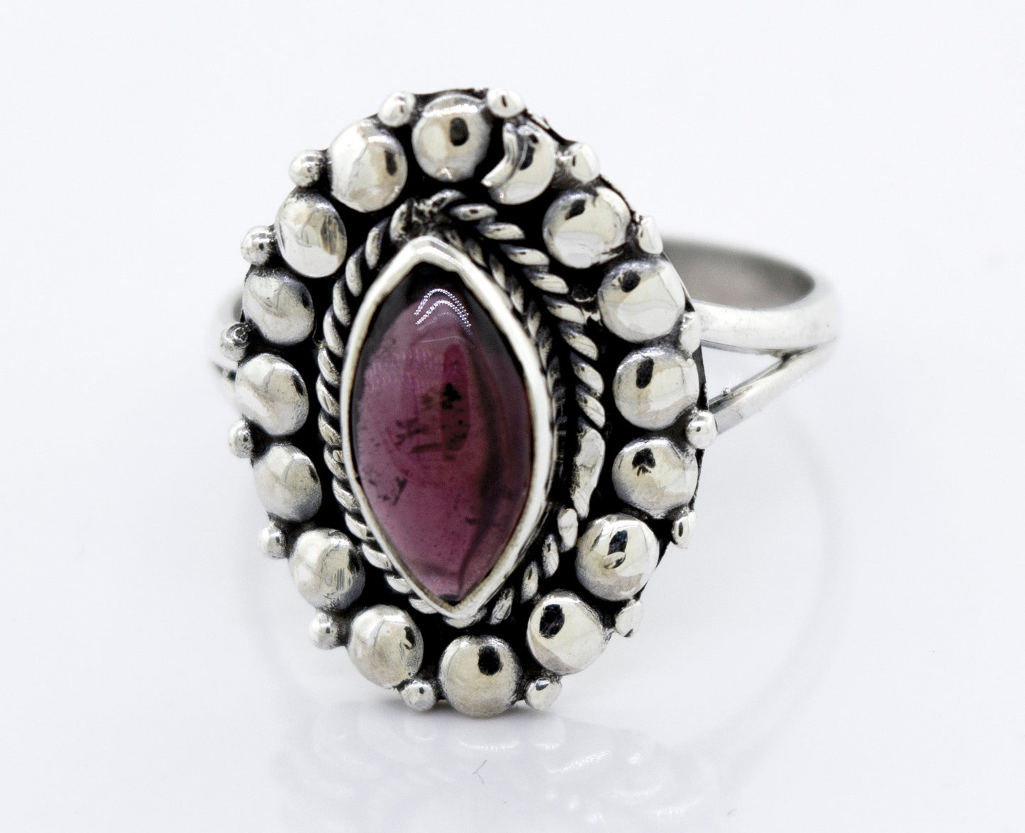 A Marquise Shaped Vibrant Garnet Ring with a garnet stone in a silver setting by Super Silver.