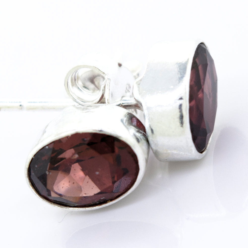 A pair of Super Silver Garnet Studs With Plain Sterling Silver Setting.