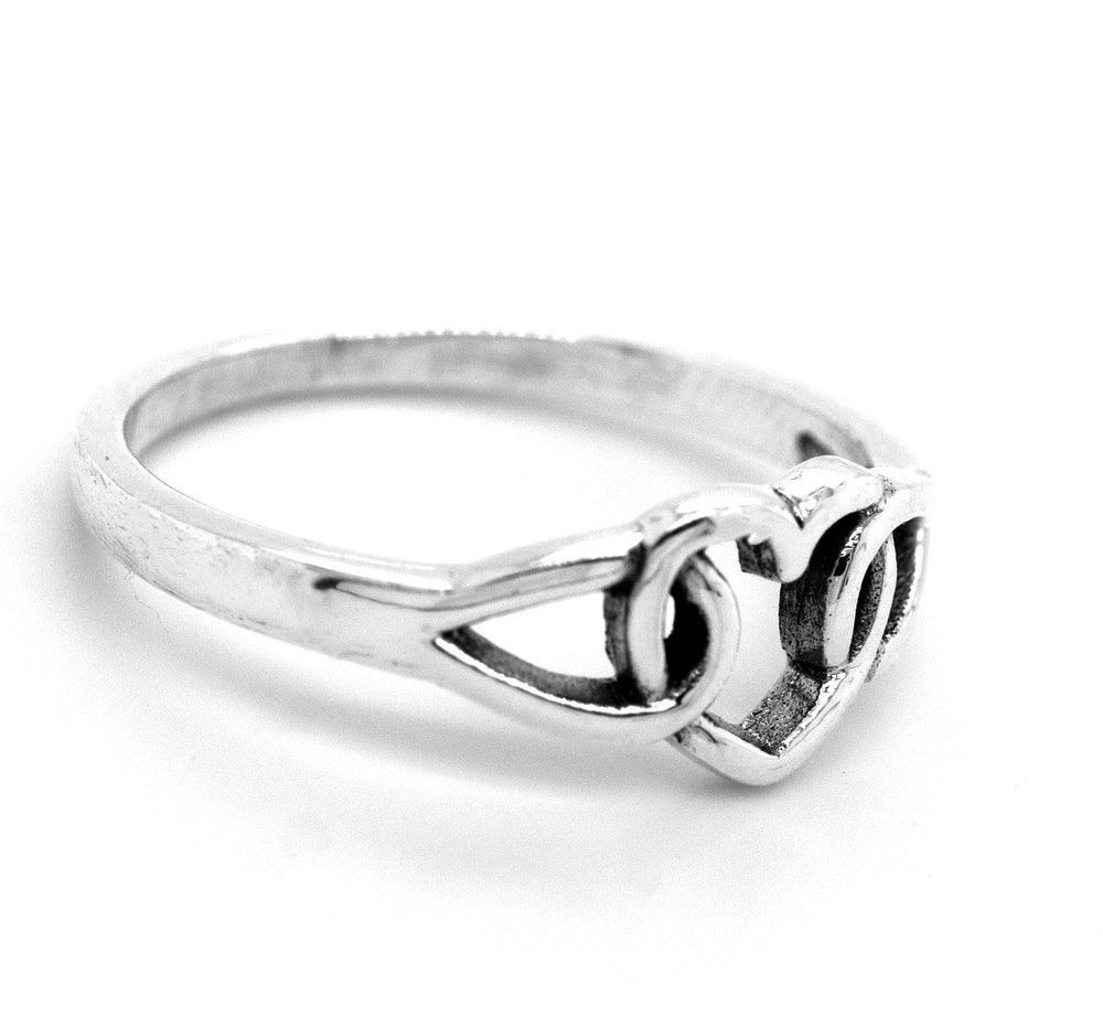 
                  
                    A minimalist Love Knot Heart Ring, made of sterling silver and featuring a heart knot design at the center, symbolizes love.
                  
                